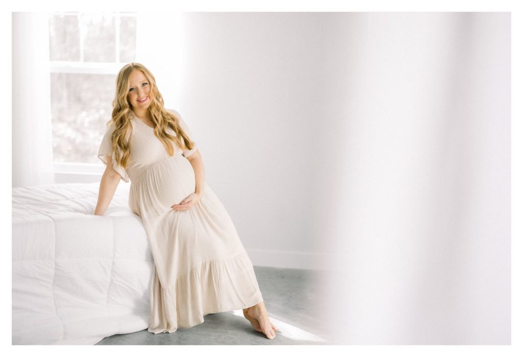 Maternity photos in Rolla Missouri in flowing gown. 