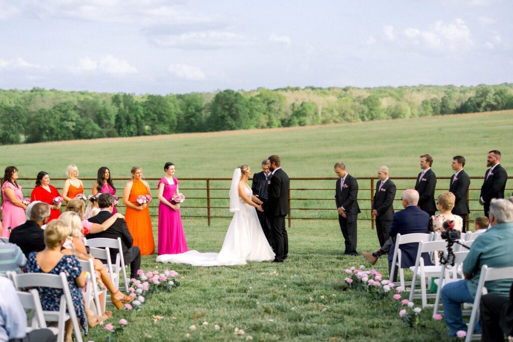 missouri_wedding_photographer_best_light_nature_flowers_outdoors_farm_white_barn_red_oak_valley_ownesville_mo_videography_photography_dress_inspo_ideas_near_me_find_bright_pink_colorful_summer_spring_